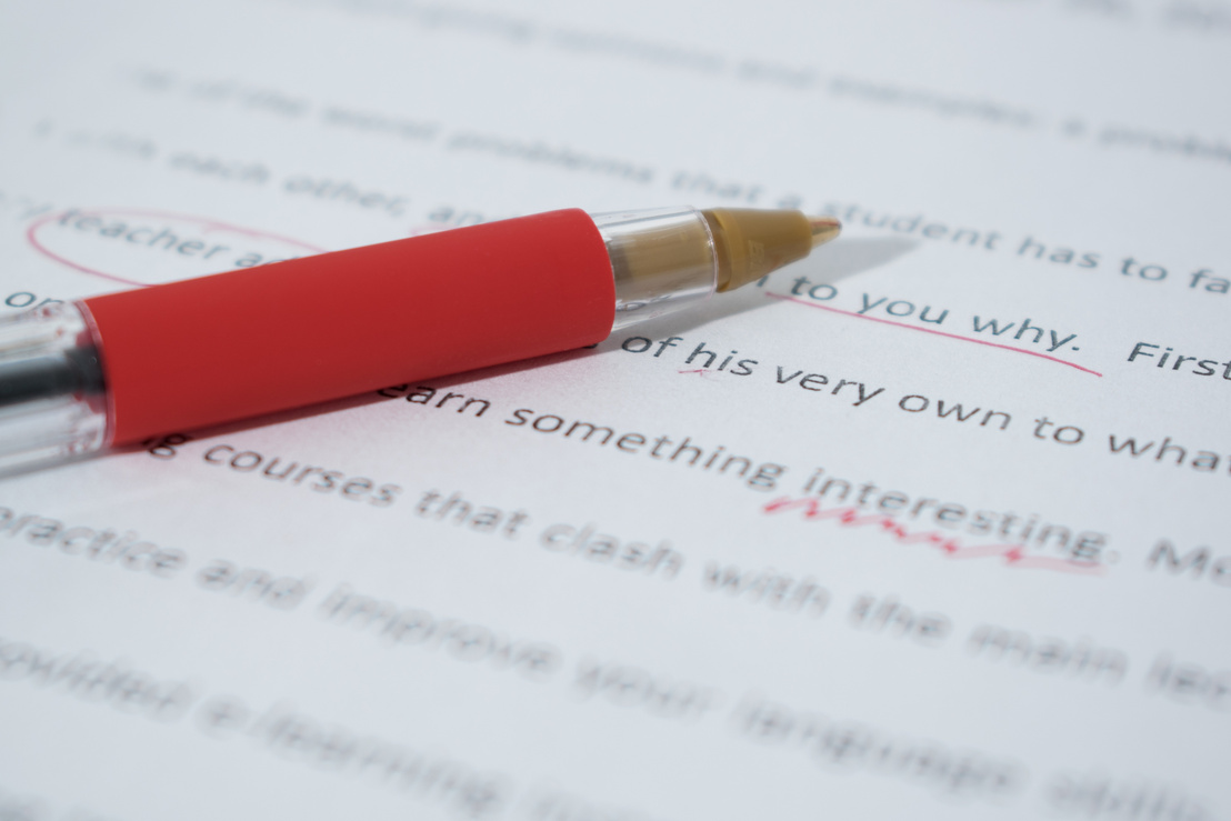 Red Pen on English Grammar Text